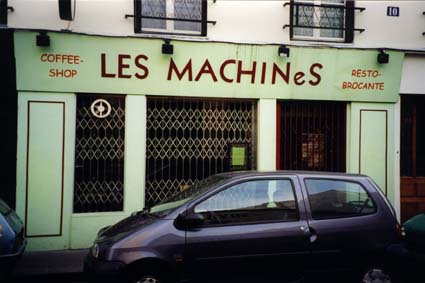 Front of: “Les Machines” coffee shop, restaurant-flea market.